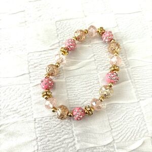 Bracelet pink bejeweled beads. Fits wrist up to 8 inches. NWT